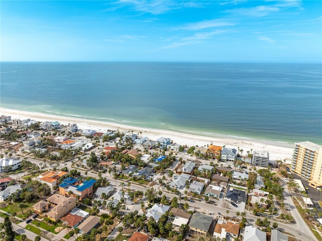 aerial view with a water view and a beach view