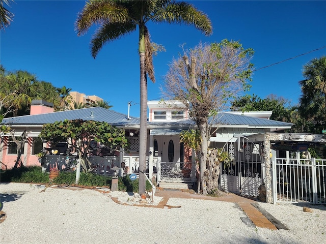 view of front facade with a porch and a carport