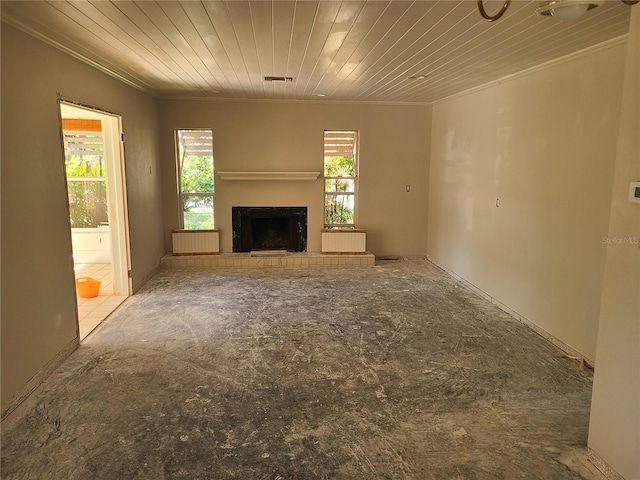 unfurnished living room featuring wood ceiling and ornamental molding