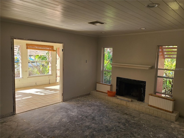 unfurnished living room featuring crown molding