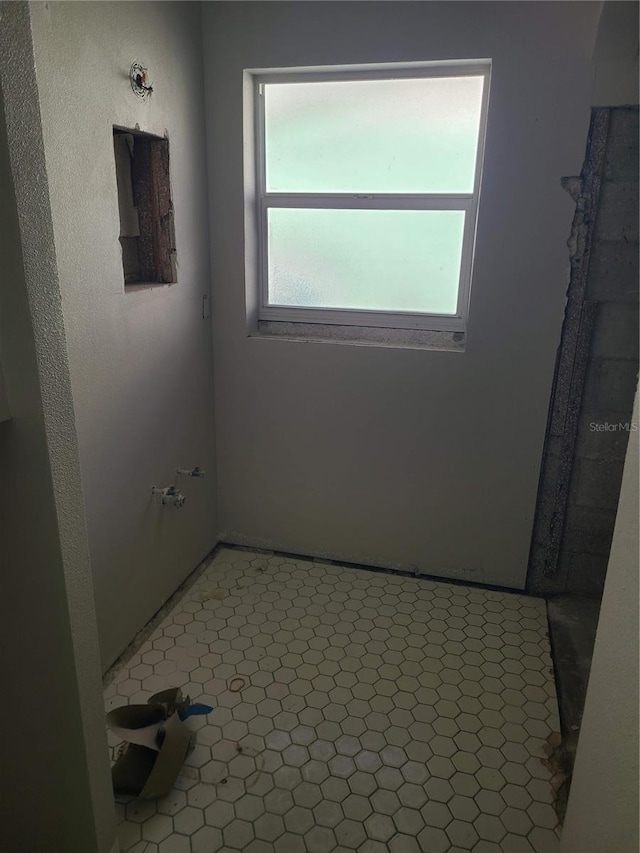 bathroom with tile patterned flooring