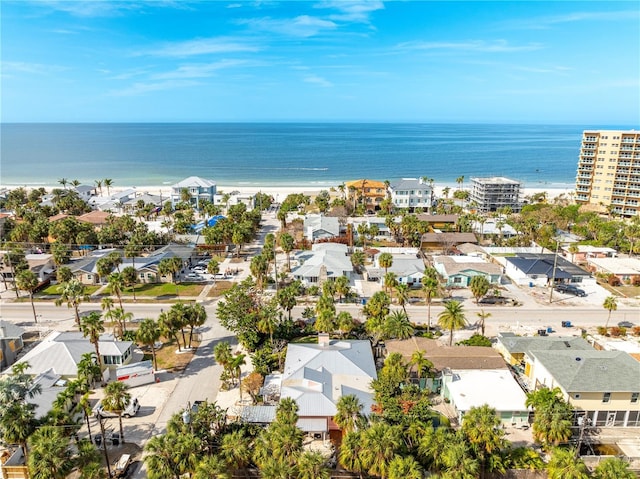 bird's eye view featuring a water view and a view of the beach