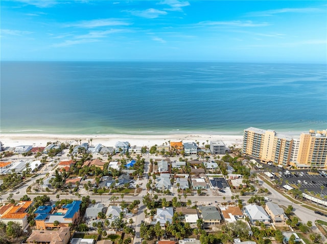 bird's eye view featuring a water view and a beach view