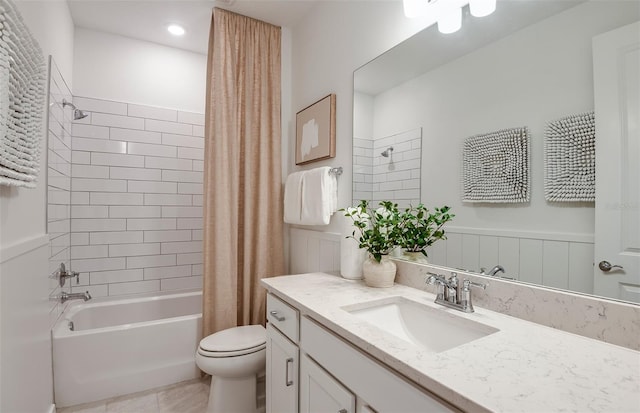 full bathroom featuring tile patterned flooring, vanity, toilet, and shower / tub combo