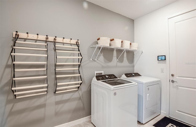 laundry area with washing machine and clothes dryer