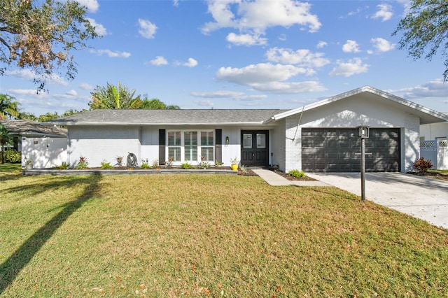 single story home featuring a garage, brick siding, and a front lawn