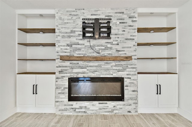 interior details featuring wood-type flooring and built in features