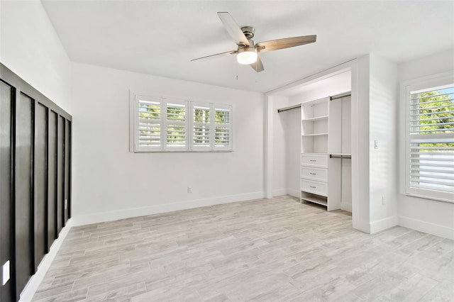 unfurnished bedroom with light wood-type flooring, a closet, and ceiling fan