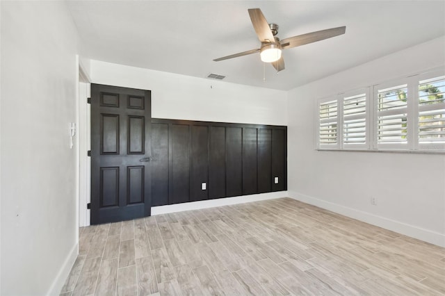 unfurnished bedroom featuring light hardwood / wood-style flooring and ceiling fan