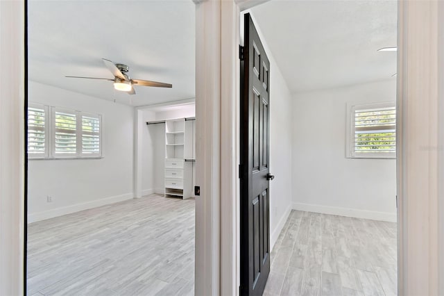 hallway with light wood-type flooring