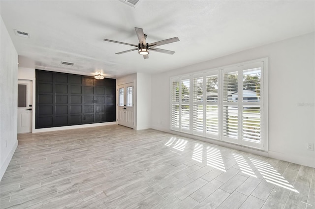 unfurnished room featuring light hardwood / wood-style floors and ceiling fan