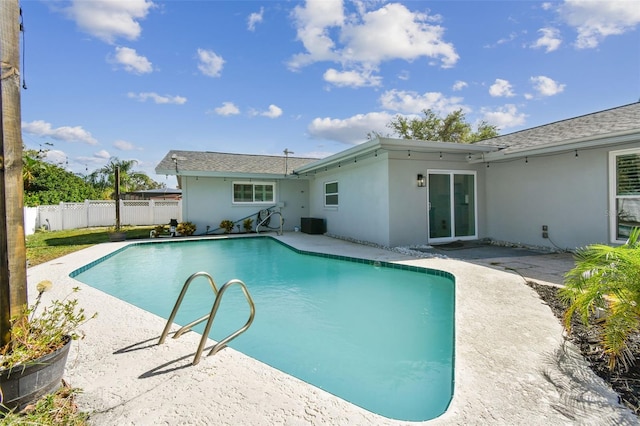 view of pool featuring a patio area and cooling unit