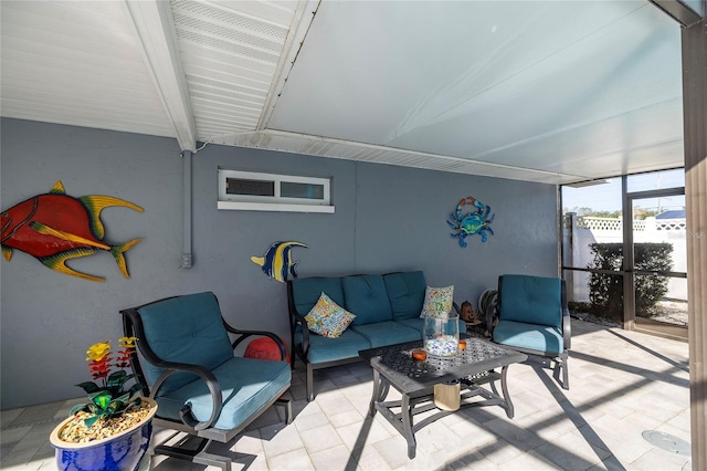 living room with beam ceiling