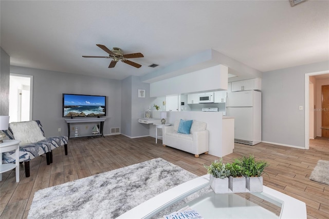 living room featuring ceiling fan