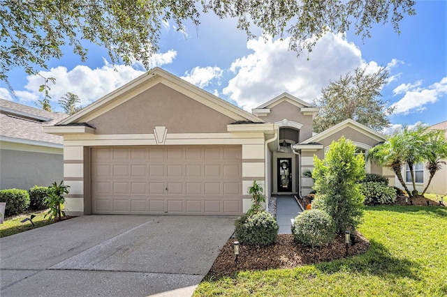 view of front of property featuring a front yard and a garage