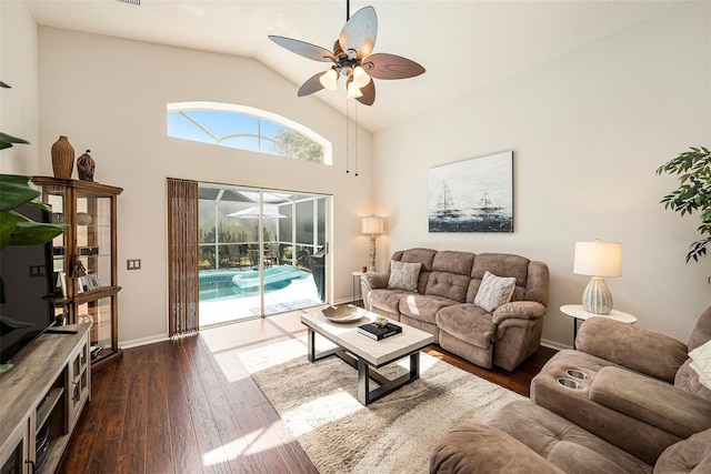 living room featuring lofted ceiling, ceiling fan, and dark hardwood / wood-style flooring