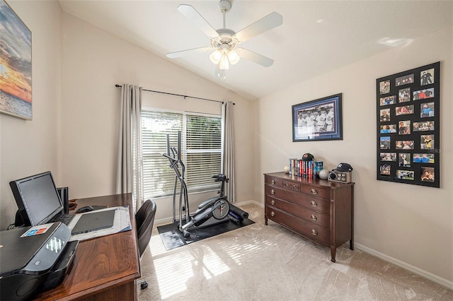 carpeted office space with ceiling fan and lofted ceiling