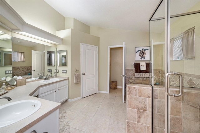 bathroom featuring vanity, an enclosed shower, lofted ceiling, and tile patterned flooring