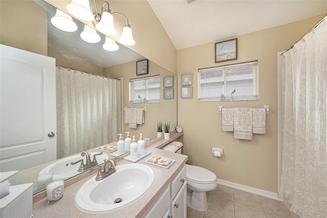 bathroom with vanity, lofted ceiling, toilet, and tile patterned flooring