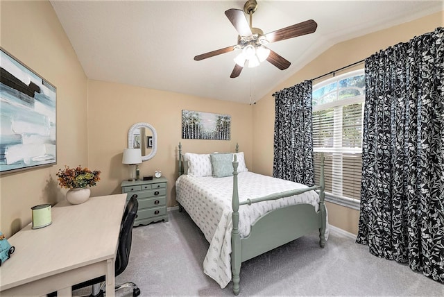 bedroom featuring lofted ceiling, light colored carpet, and ceiling fan