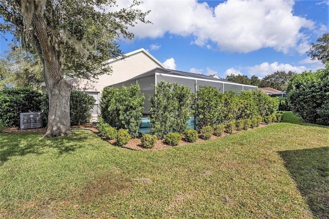 view of home's exterior with a lawn and cooling unit