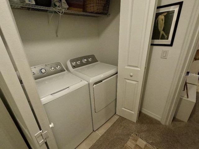 washroom featuring separate washer and dryer and light colored carpet