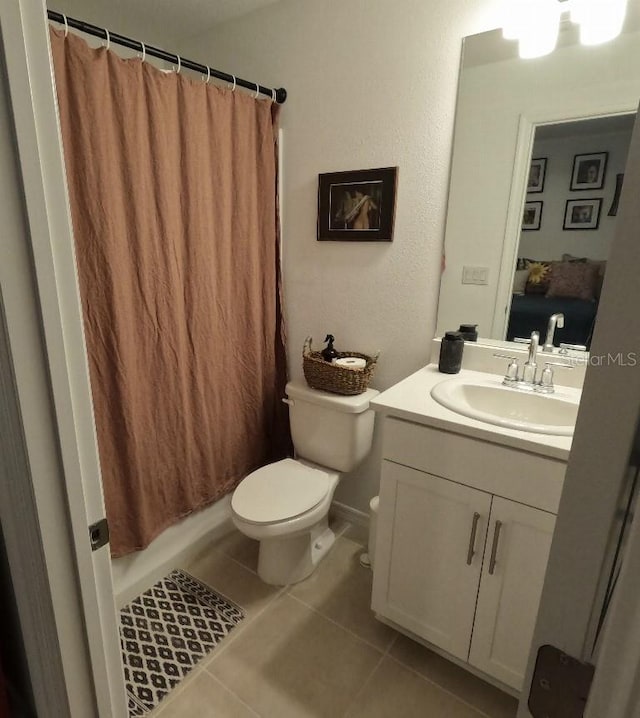 full bathroom with toilet, shower / bath combination with curtain, vanity, and tile patterned floors