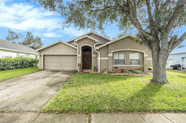 ranch-style home featuring a front yard and a garage