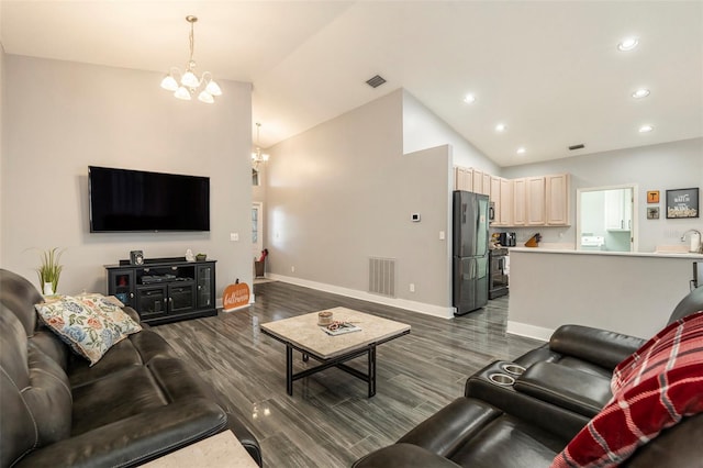 living room featuring a chandelier, dark hardwood / wood-style floors, and high vaulted ceiling