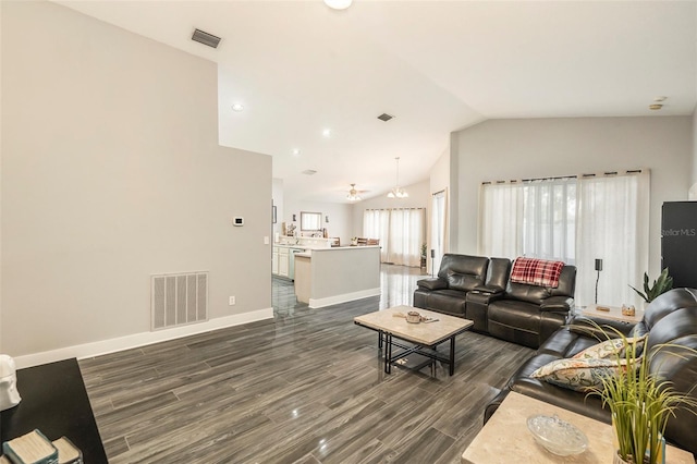 living room featuring lofted ceiling and dark wood-type flooring