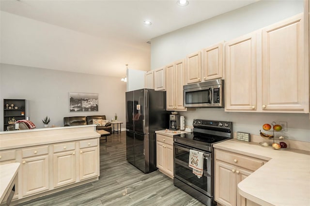 kitchen featuring appliances with stainless steel finishes and light wood-type flooring