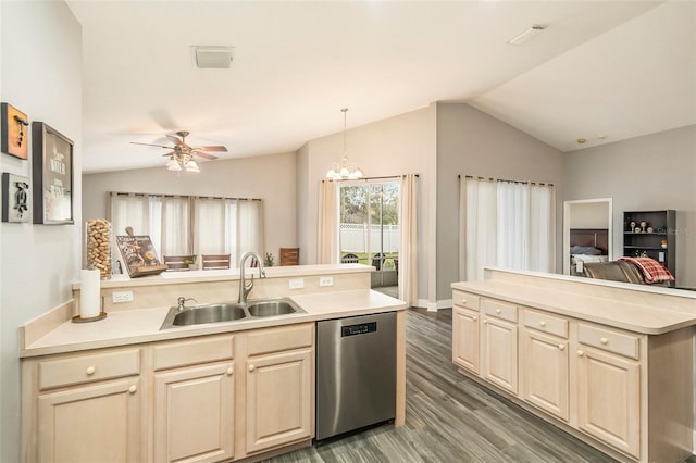 kitchen with sink, hanging light fixtures, vaulted ceiling, stainless steel dishwasher, and dark wood-type flooring