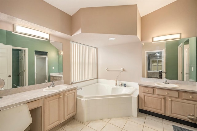 bathroom featuring vanity, plus walk in shower, tile patterned floors, and a towering ceiling