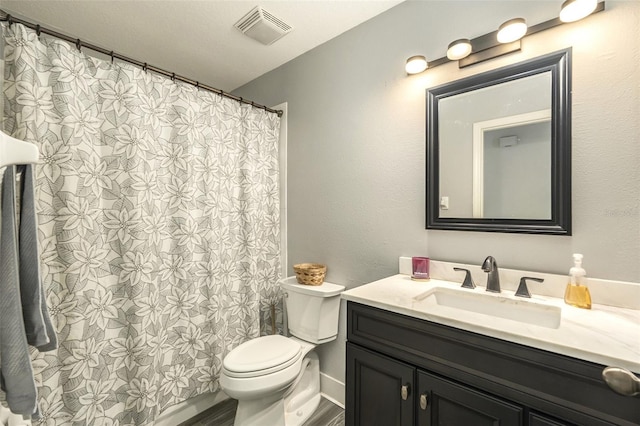 bathroom featuring vanity, toilet, hardwood / wood-style flooring, and a shower with shower curtain