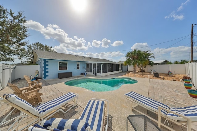 view of pool featuring a patio and a sunroom