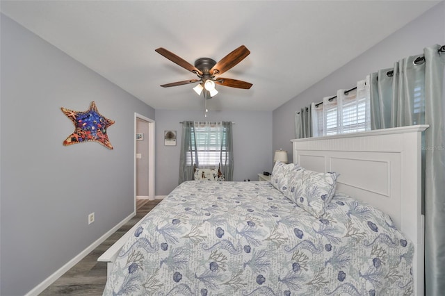 bedroom featuring dark wood-type flooring and ceiling fan