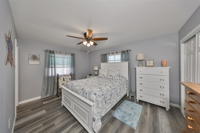 bedroom with ceiling fan and dark hardwood / wood-style floors