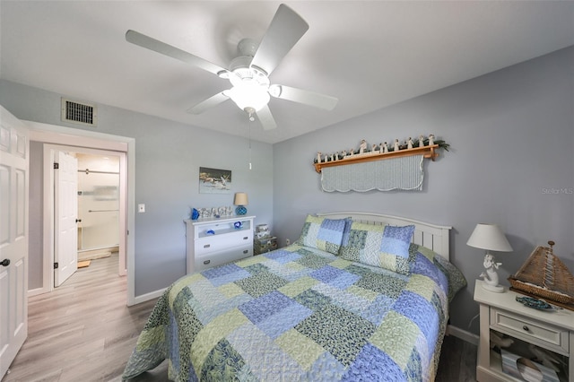 bedroom featuring light hardwood / wood-style floors and ceiling fan