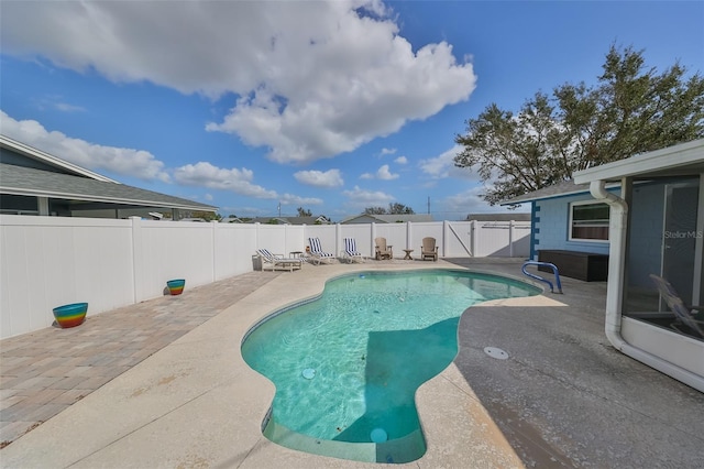 view of swimming pool with a patio