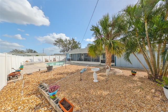 view of yard with a patio and a fenced in pool