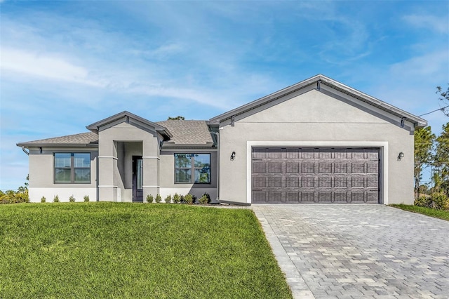 ranch-style home with a garage and a front yard