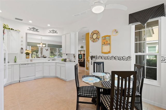 kitchen with white cabinetry, white dishwasher, and a wealth of natural light