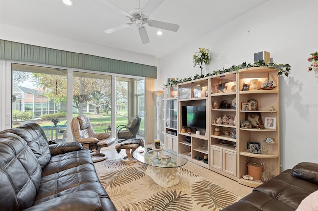 living room featuring lofted ceiling and ceiling fan