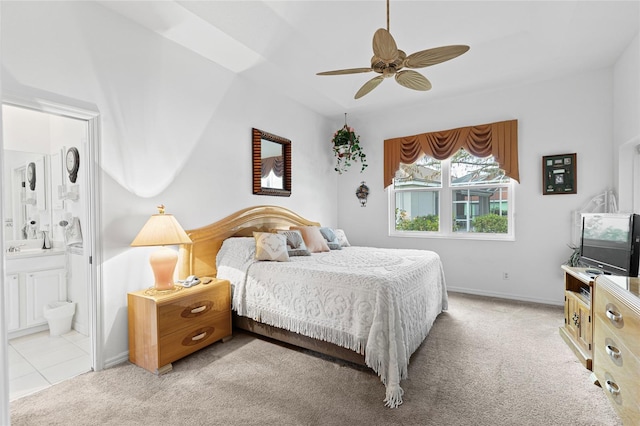 5195 Highbury Cir, Sarasota, FL 34238 - bedroom featuring baseboards, ceiling fan, light carpet, and ensuite bathroom