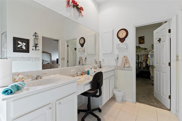 5195 Highbury Cir, Sarasota, FL 34238 - full bath featuring a sink, a walk in closet, tile patterned flooring, and double vanity