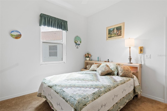 bedroom with ceiling fan and carpet flooring