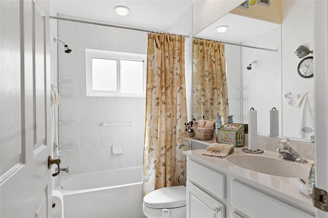 full bathroom with vanity, shower / bath combo with shower curtain, and toilet