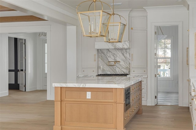 bar with light brown cabinets, light hardwood / wood-style flooring, decorative backsplash, and beamed ceiling