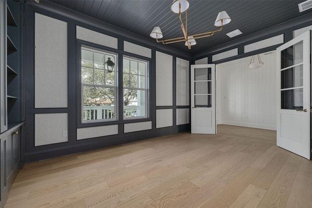 unfurnished room with light wood-type flooring