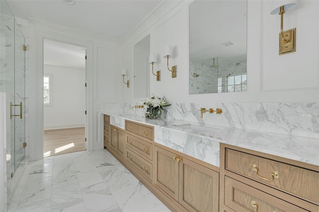 bathroom featuring vanity, an enclosed shower, and crown molding